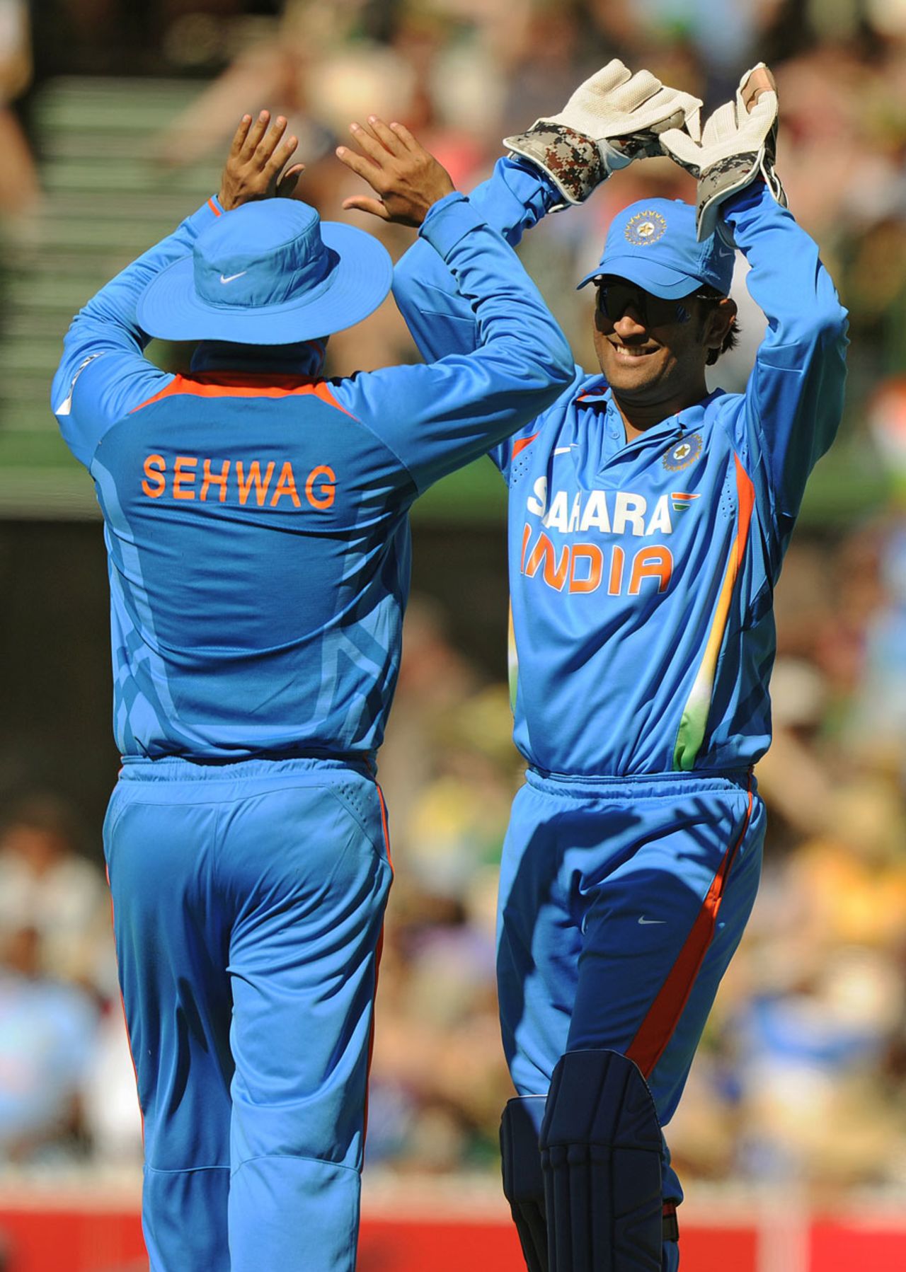 MS Dhoni congratulates Virender Sehwag on catching David Hussey, Australia v India, Commonwealth Bank Series, Adelaide, February 12, 2012
