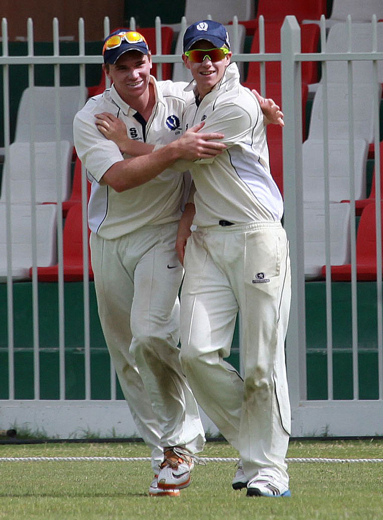 Ryan Flannigan celebrates with a team-mate after taking a catch, UAE v Scotland, Intercontinental Cup, 3rd day, Sharjah, February 18, 2012