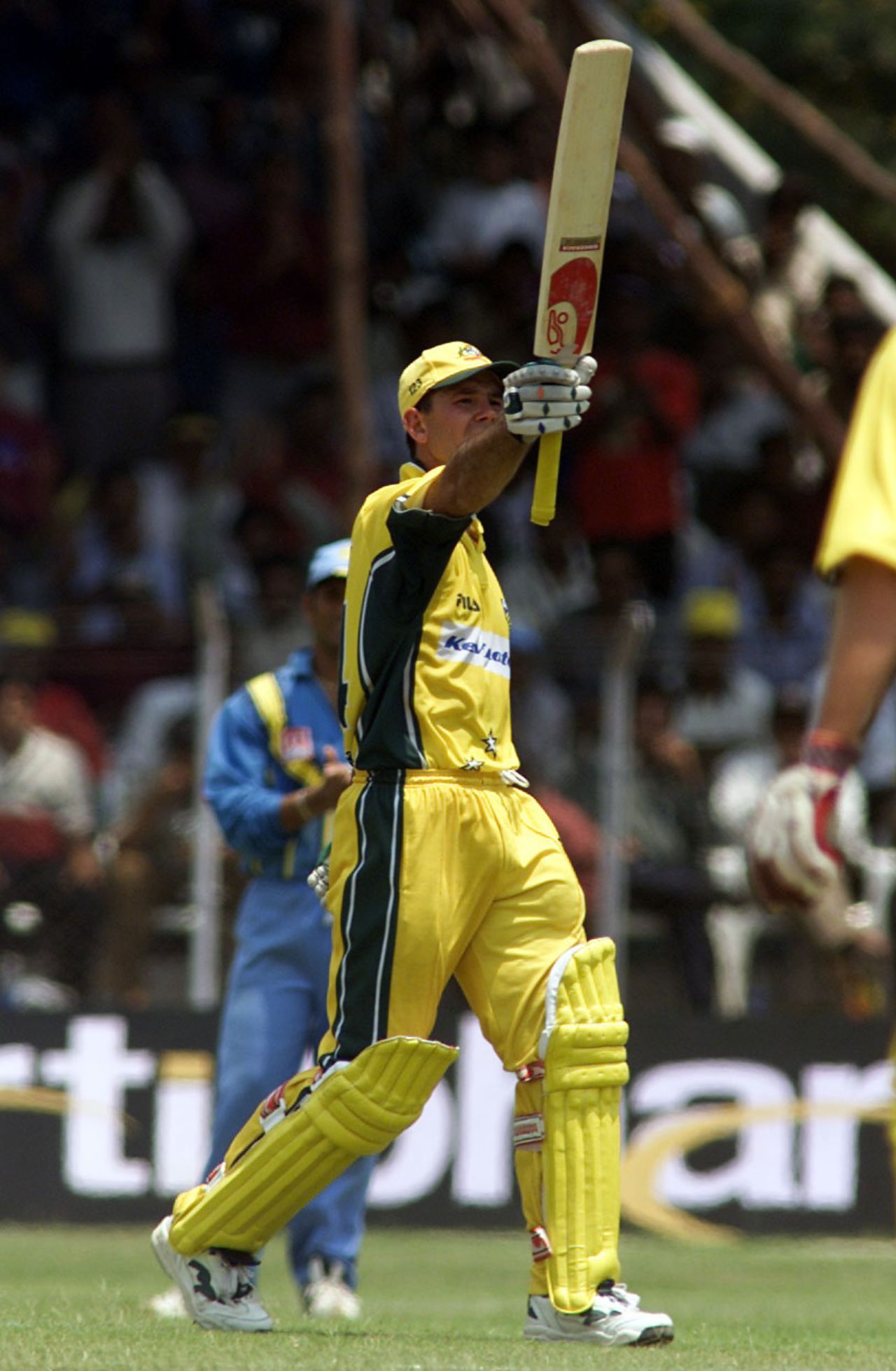 Ponting raises his bat to celebrate a century , 03 Apr 2001: Australia in India 2000/01, 4th One-Day International, India v Australia, Indira Priyadarshini Stadium, Visakhapatnam.