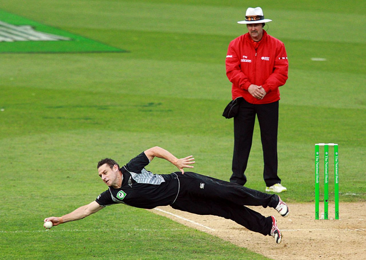Nathan McCullum stretches to field off his own bowling, New Zealand v South Africa, 1st ODI , Wellington, February 25, 2012