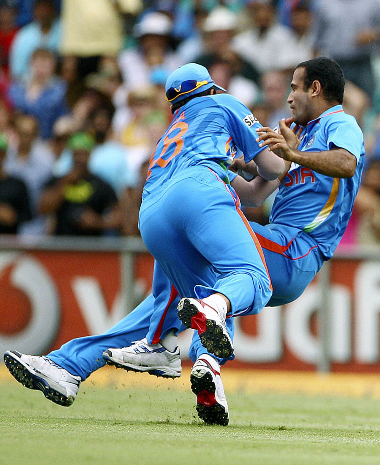 Suresh Raina collides with Irfan Pathan in the process of catching David Warner, Australia v India, CB Series, Sydney, February 26, 2012