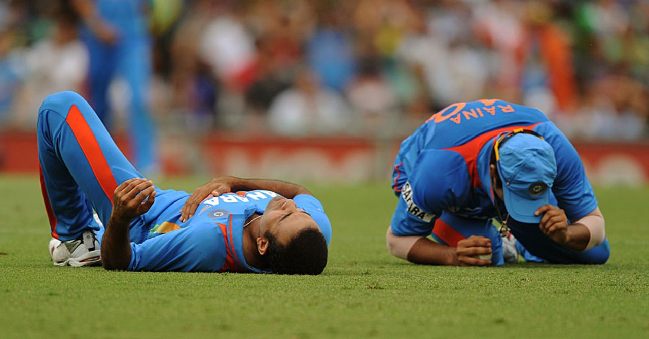 Irfan Pathan and Suresh Raina after their collision, Australia v India, CB Series, Sydney, February 26, 2012