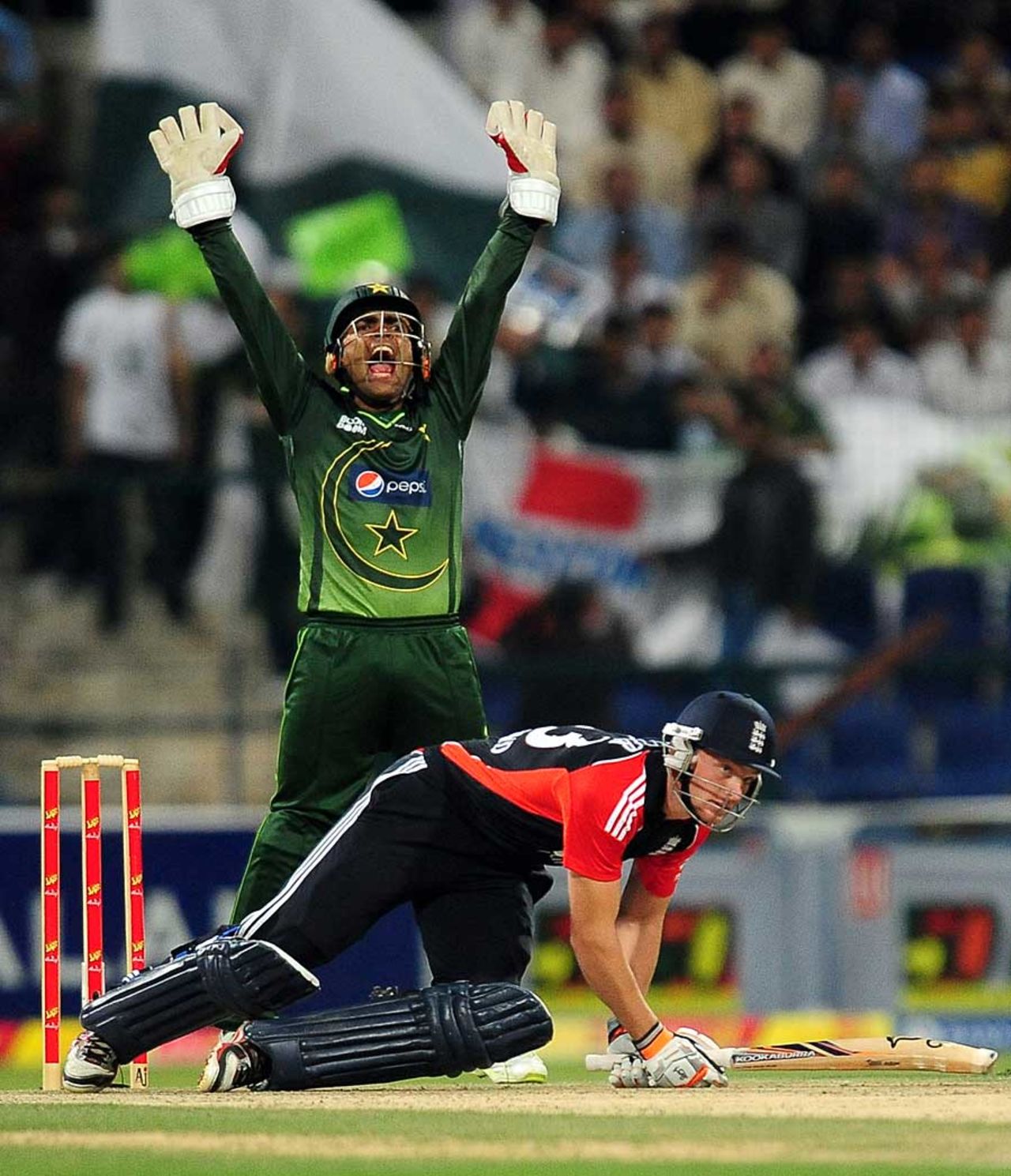 Jos Buttler ended up on his knees when given lbw, Pakistan v England, 3rd Twenty20, Abu Dhabi, February 27, 2012