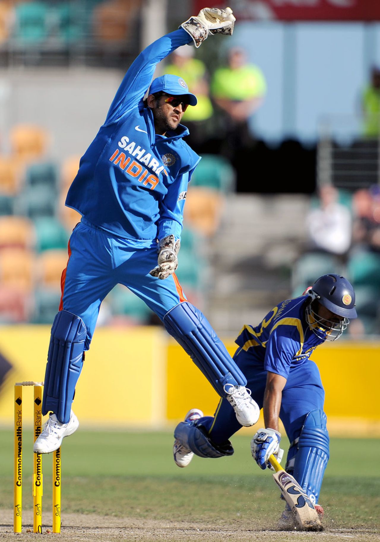 MS Dhoni leaps to collect a return, India v Sri Lanka, CB series, Hobart, February 28, 2012