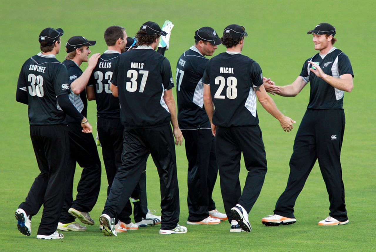 Martin Guptill's team-mates converge on him after he took the catch to dismiss Faf du Plessis, New Zealand v South Africa, 2nd ODI, Napier, February 29, 2012