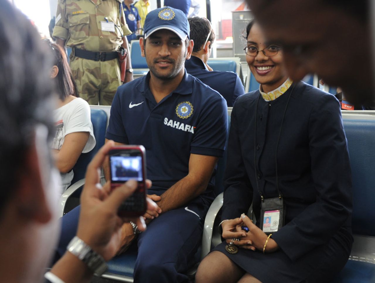 MS Dhoni poses for a photo with a flight attendant, Visakhapatnam, October 21, 2010