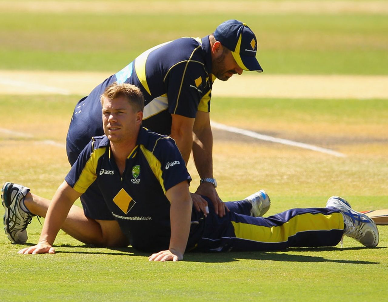 David Warner stretches with the physio Alex Kountouris, Australia v Sri Lanka, Commonwealth Bank Series, 2nd final, Adelaide, March 6, 2012