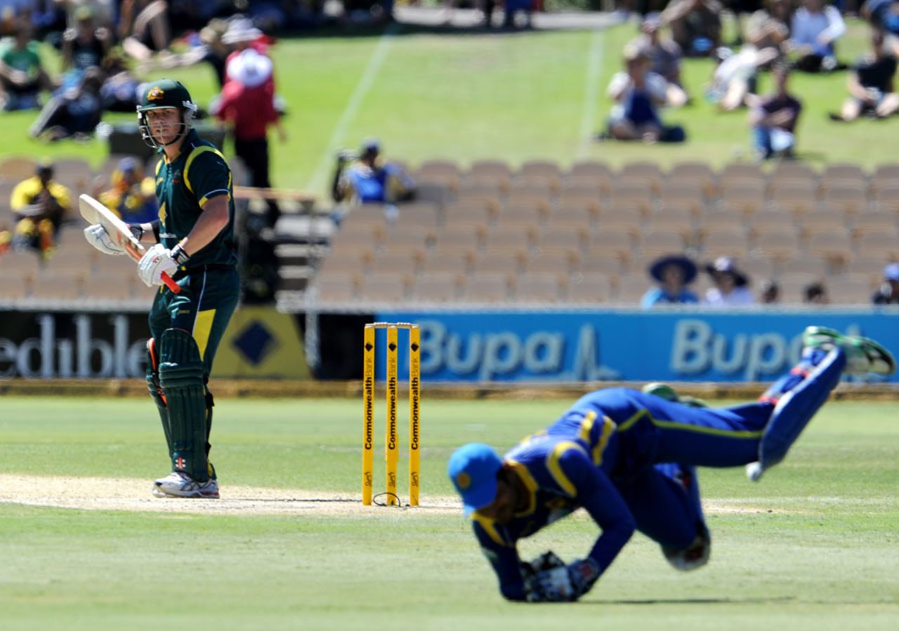 David Warner watches as Kumar Sangakkara pouches his catch, Australia v Sri Lanka, CB Series, 3rd final, Adelaide, March 8, 2012