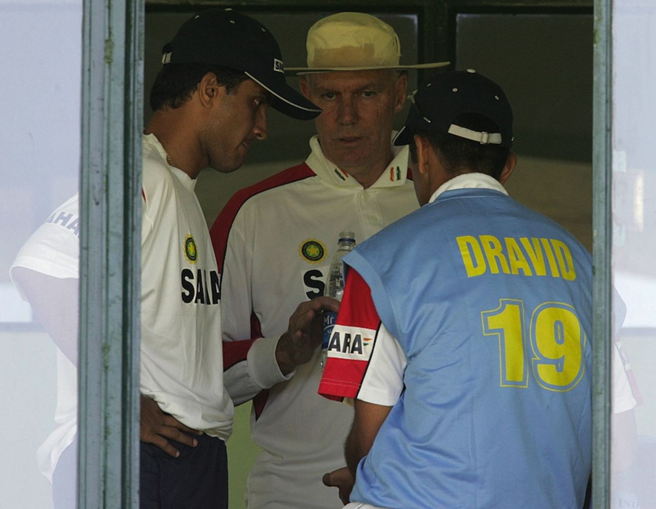 Greg Chappell chats with Rahul Dravid and Sourav Ganguly, Harare, September, 2005