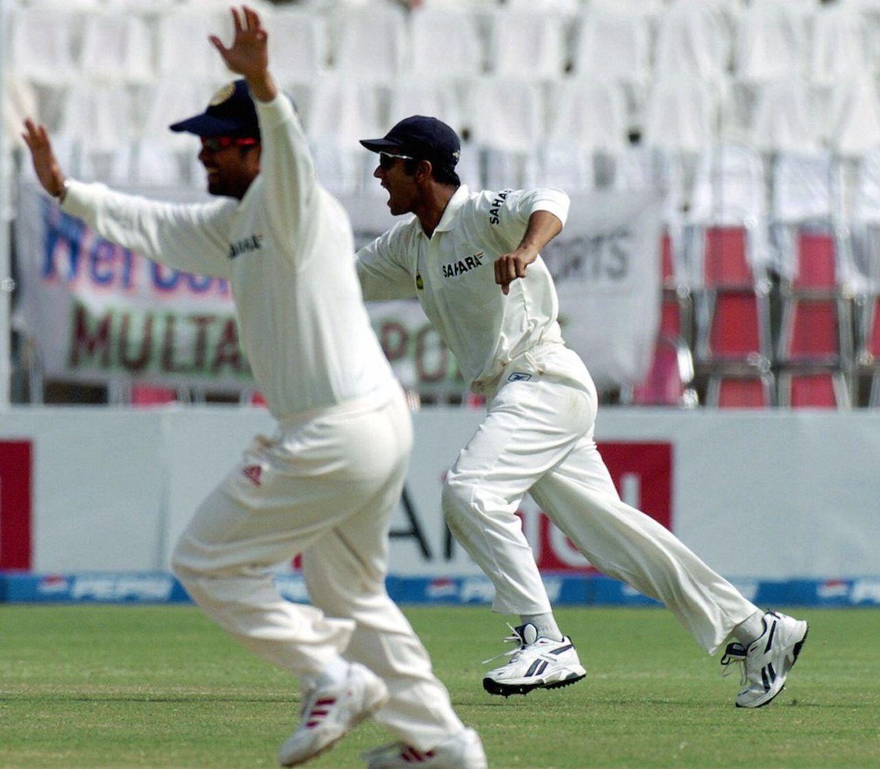 Rahul Dravid and Sachin Tendulkar celebrate the final wicket, Pakistan v India, 1st Test, Multan, 5th day, April 1, 2004