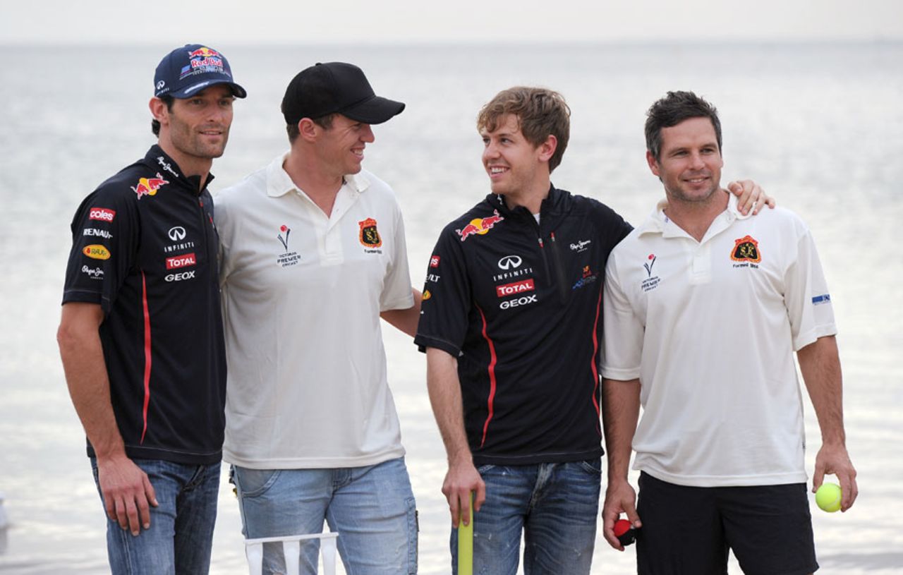 Peter Siddle and Brad Hodge with Formula 1 drivers Mark Webber and Sebastian Vettel, Melbourne, March 14, 2012