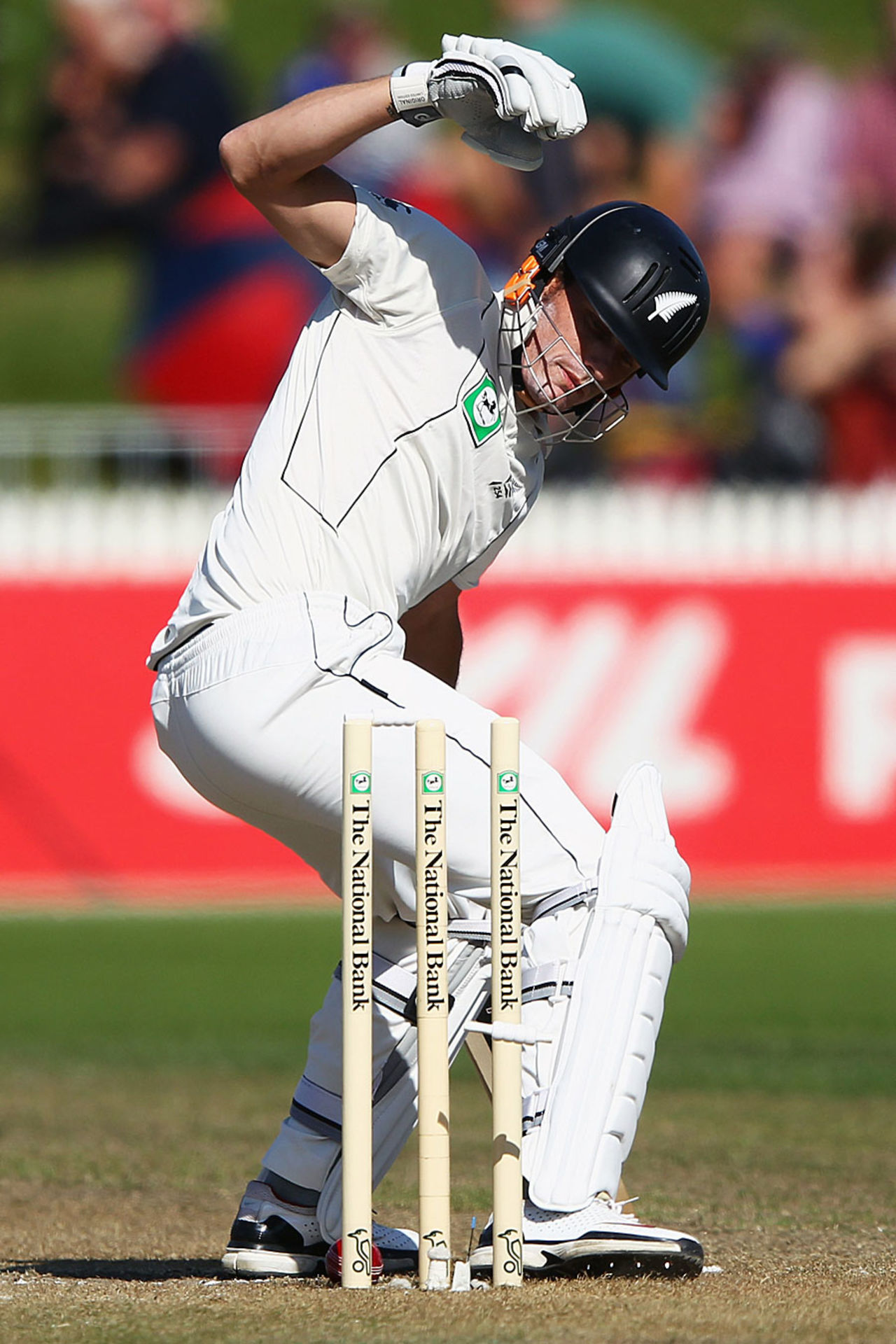 Rob Nicol unsuccessfully attempts to stop the ball from rolling onto his stumps, New Zealand v South Africa, 2nd Test, Hamilton, 2nd day, March 16, 2012