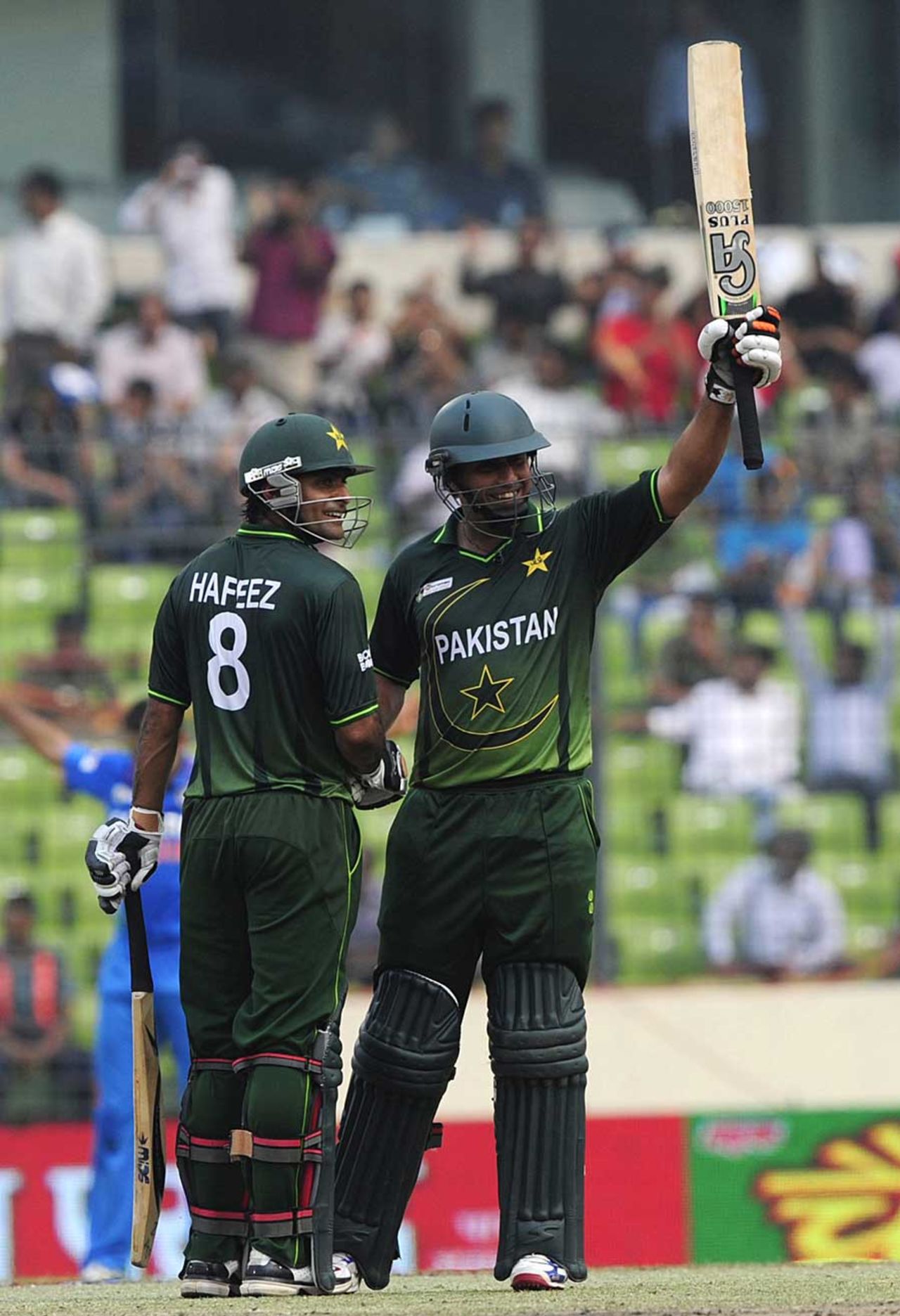 Nasir Jamshed celebrates his half-century with Mohammad Hafeez, India v Pakistan, Asia Cup, Mirpur, March 18, 2012
