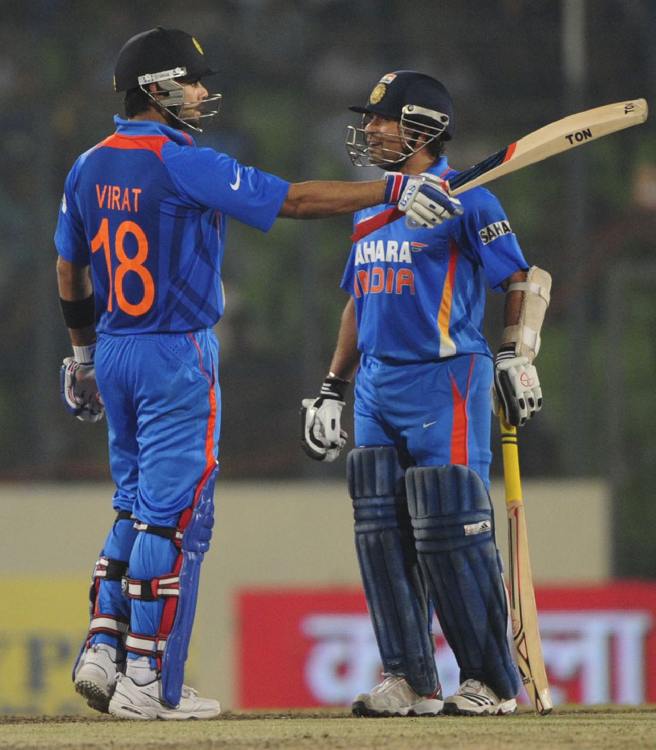 Virat Kohli raises his bat after reaching his half-century, India v Pakistan, Asia Cup, Mirpur, March 18, 2012