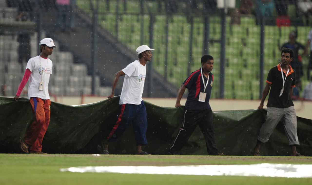The covers come on at the Shere Bangla Stadium, Bangladesh v Sri Lanka, Asia Cup, Mirpur, March 20, 2012