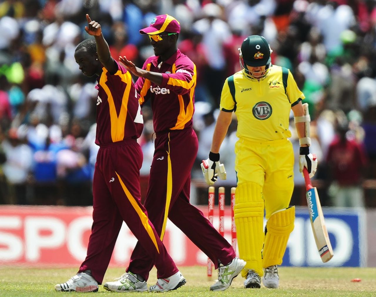Kemar Roach celebrates a wicket with his captain Darren Sammy, West Indies v Australia, 3rd ODI, St Vincent, March 20, 2012