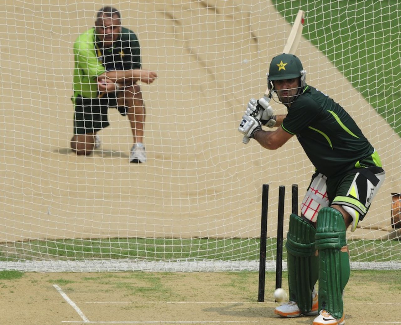 Dav Whatmore watches Misbah-ul-Haq bat on the eve of the Asia Cup final, Mirpur, March 21, 2012