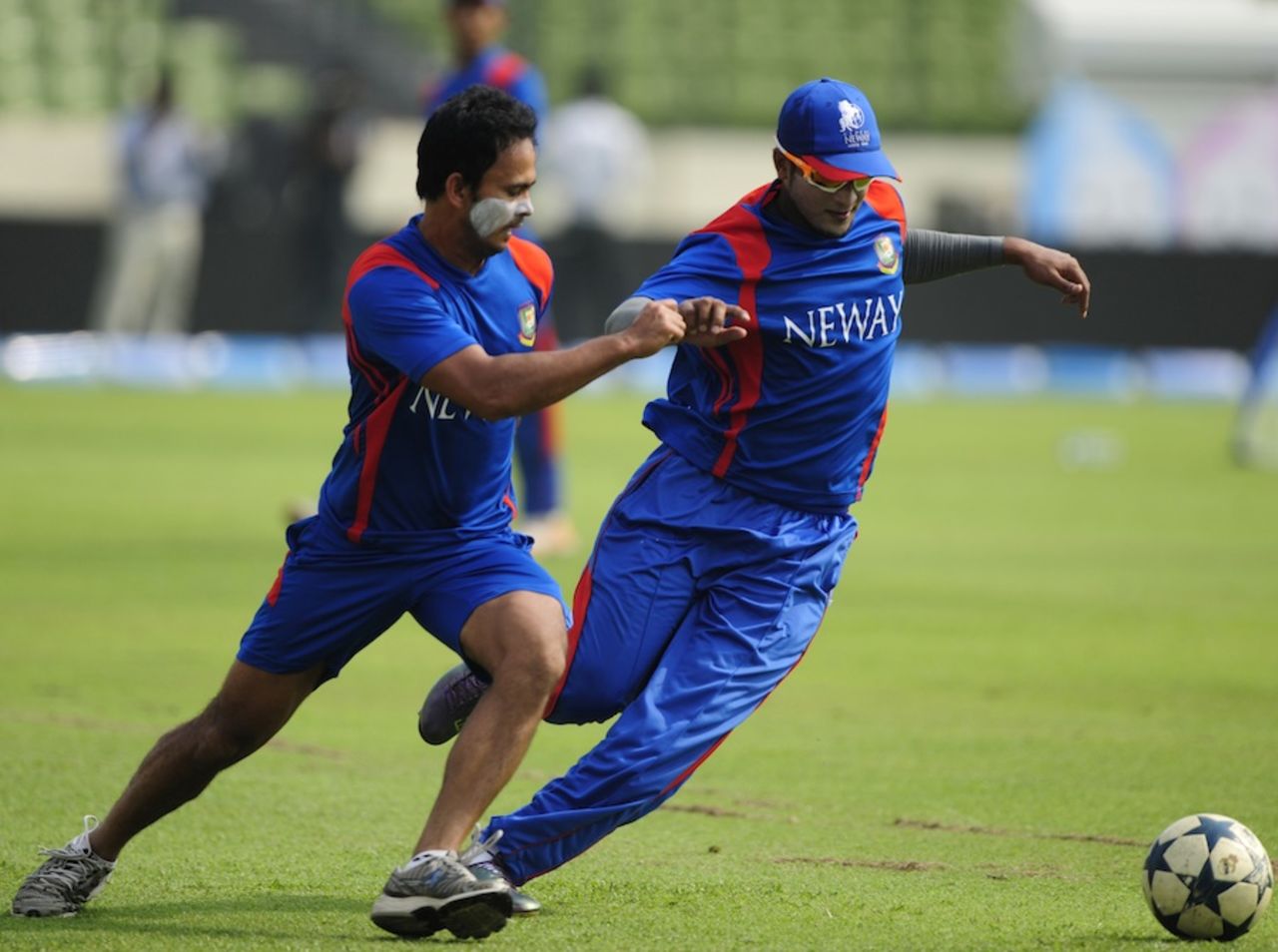 Shakib Al Hasan and Nazimuddin play football during a training session on the eve of the Asia Cup final, Mirpur, March 21, 2012
