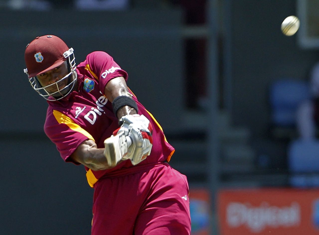 Kieron Pollard smashes a six during his innings of 102, West Indies v Australia, 4th ODI, Gros Islet, March 23, 2012