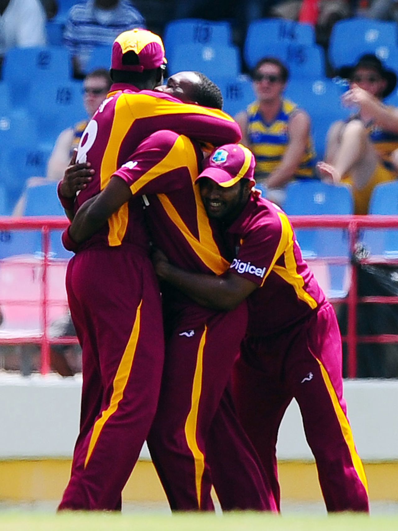 Dwayne Bravo is engulfed by his team-mates after dismissing David Warner, West Indies v Australia, 4th ODI, Gros Islet, March 23, 2012