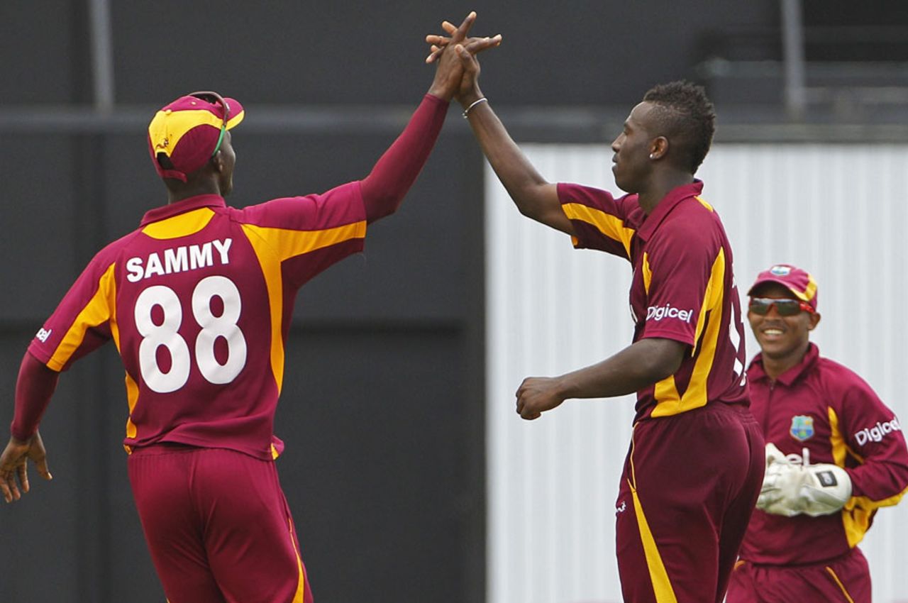 Andre Russell celebrates with this captain Darren Sammy, West Indies v Australia, 5th ODI, Gros Islet, March 25, 2012