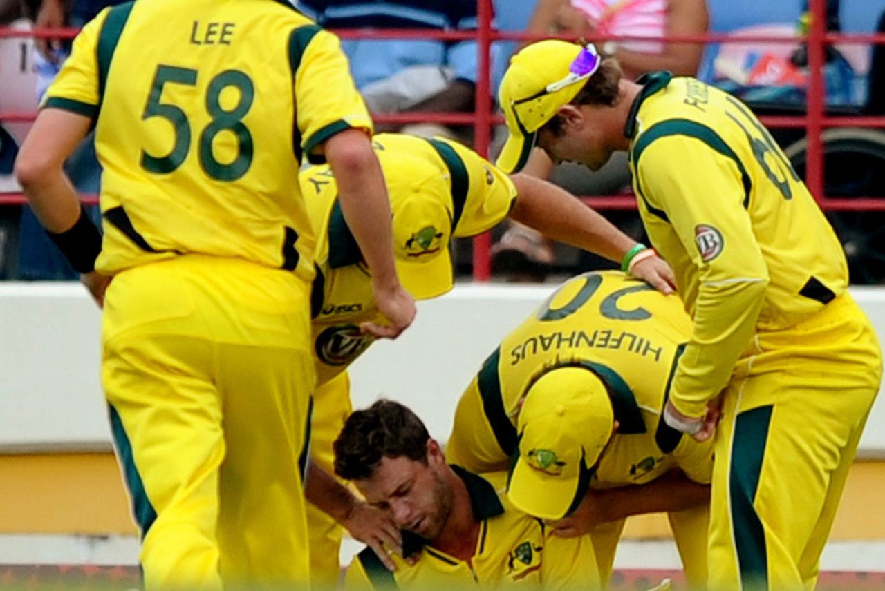 Matthew Wade is surrounded by concerned team-mates after colliding with Ben Hilfenhaus, West Indies v Australia, 5th ODI, Gros Islet, March 25, 2012