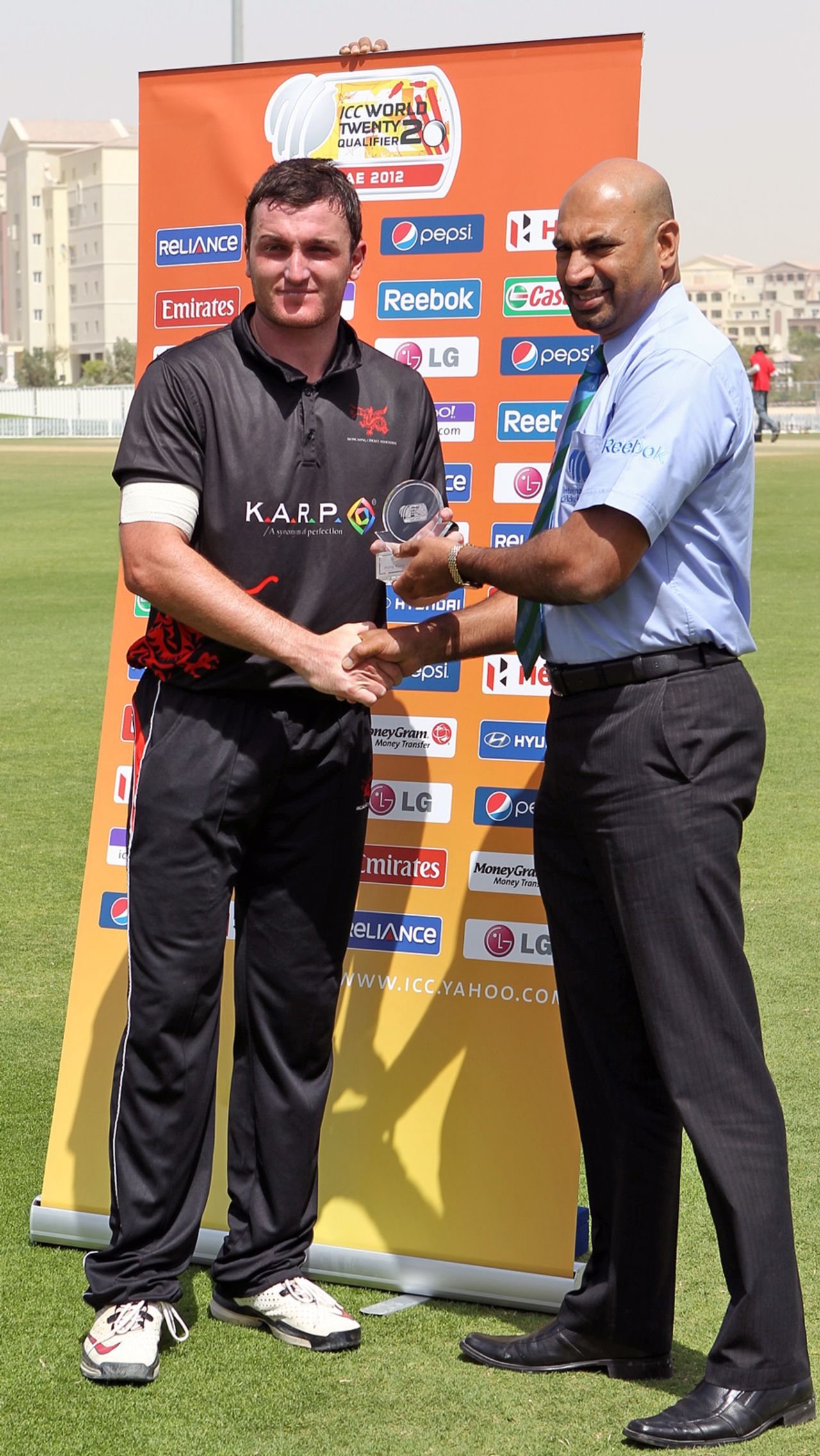 Jamie Atkinson receives his Man of the Match award from Tournament Official Graeme Labrooy after scoring 87* in the ICC World Twenty20 Qualifier match against Bermuda played at the ICC's GCA ground in Dubai on 14th March 2012