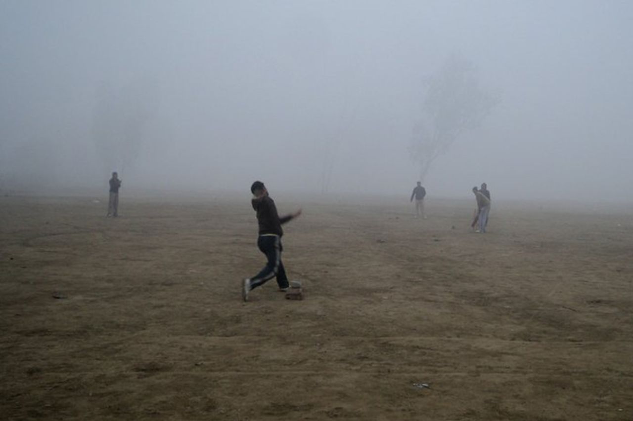 Weather proof cricket, boys play cricket in the heavy fog in the Delhi winter. Submitted by: <b>Omesh Meena</b>
