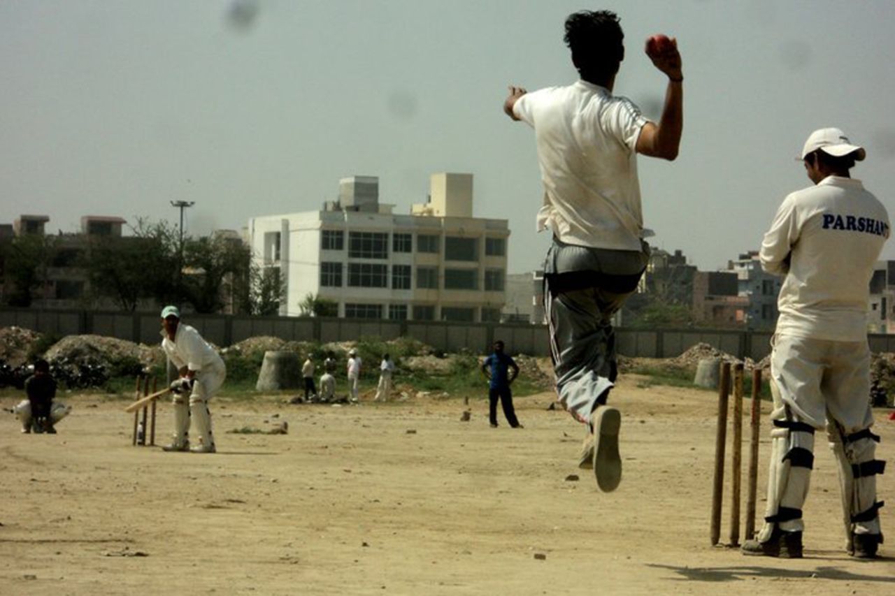 The bowler in his final delivery stride in a local match at the Mukherjee Nagar ground in New Delhi. Submitted by: <b>Omesh Meena</b>