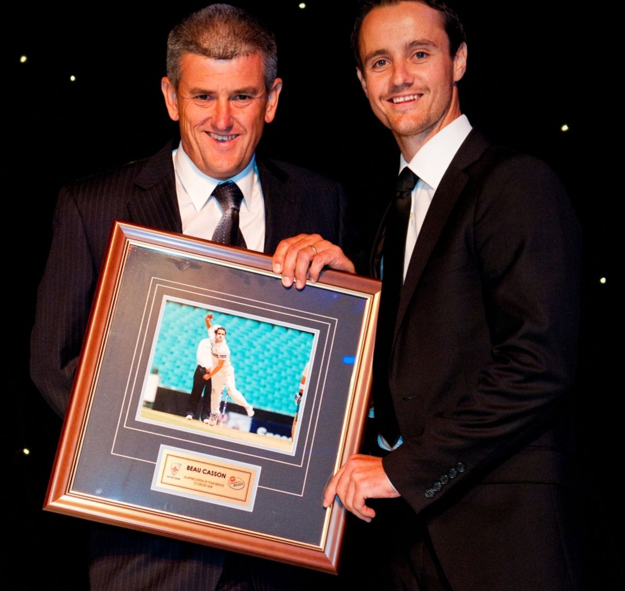 Beau Casson receives a presentation at the Cricket New South Wales awards night, Sydney, March 23, 2012