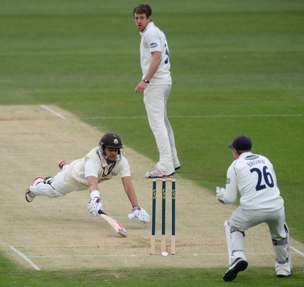 Jacques Rudolph dives to make his ground, Surrey v Sussex, County Championship, London, The Oval, 1st day, April 5, 2012