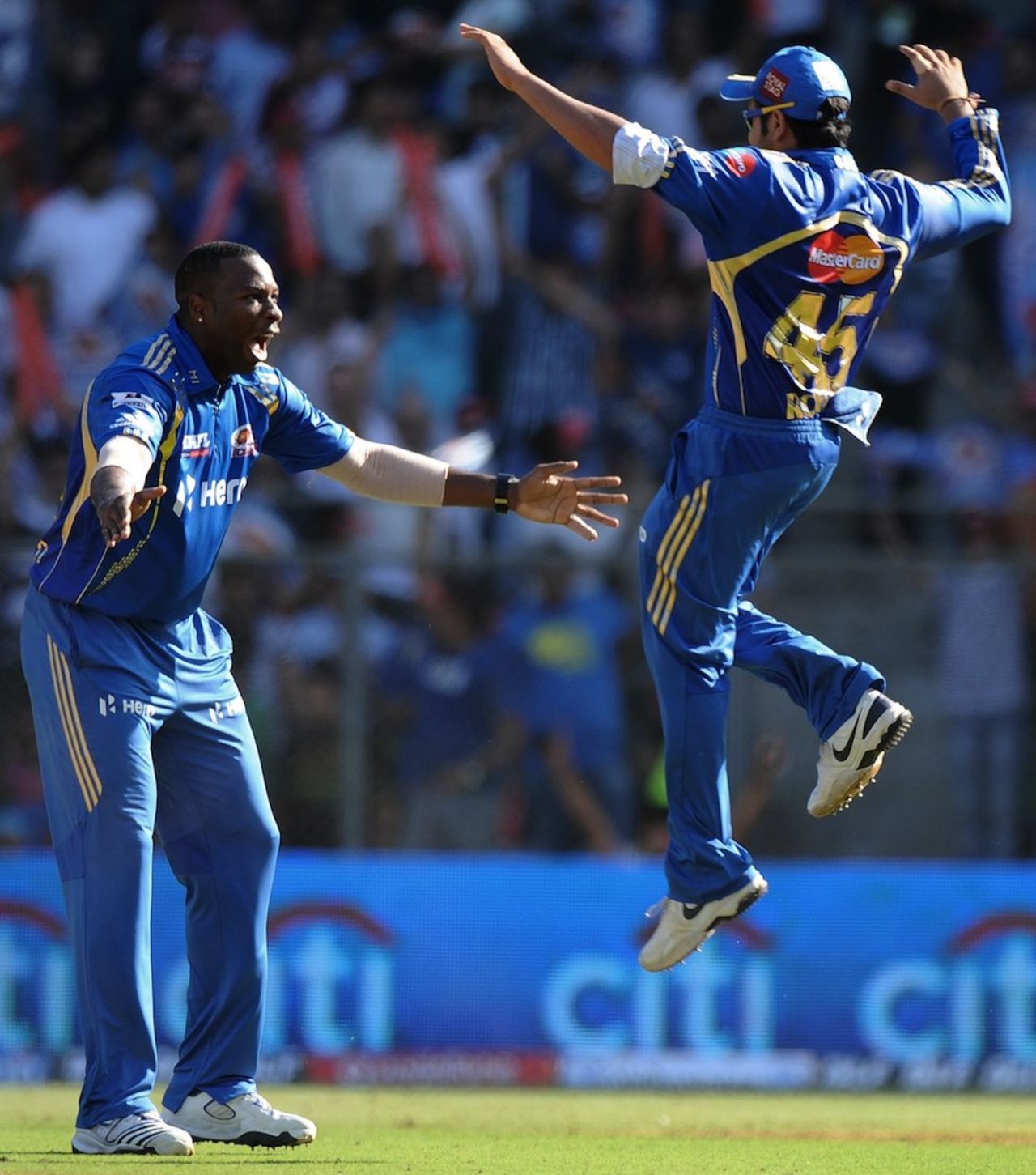 Kieron Pollard and Rohit Sharma celebrate Callum Ferguson's run-out, Mumbai Indians v Pune Warriors India, IPL, Mumbai, April 6, 2012