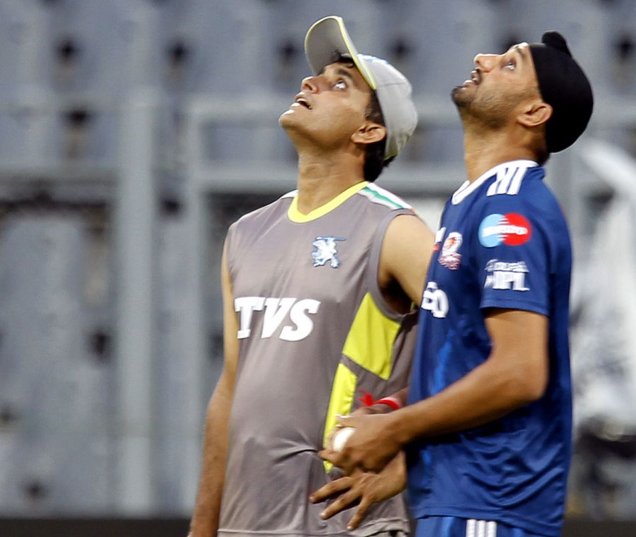 Sourav Ganguly and Harbhajan look up during a practice session, IPL, Mumbai, April 5, 2012