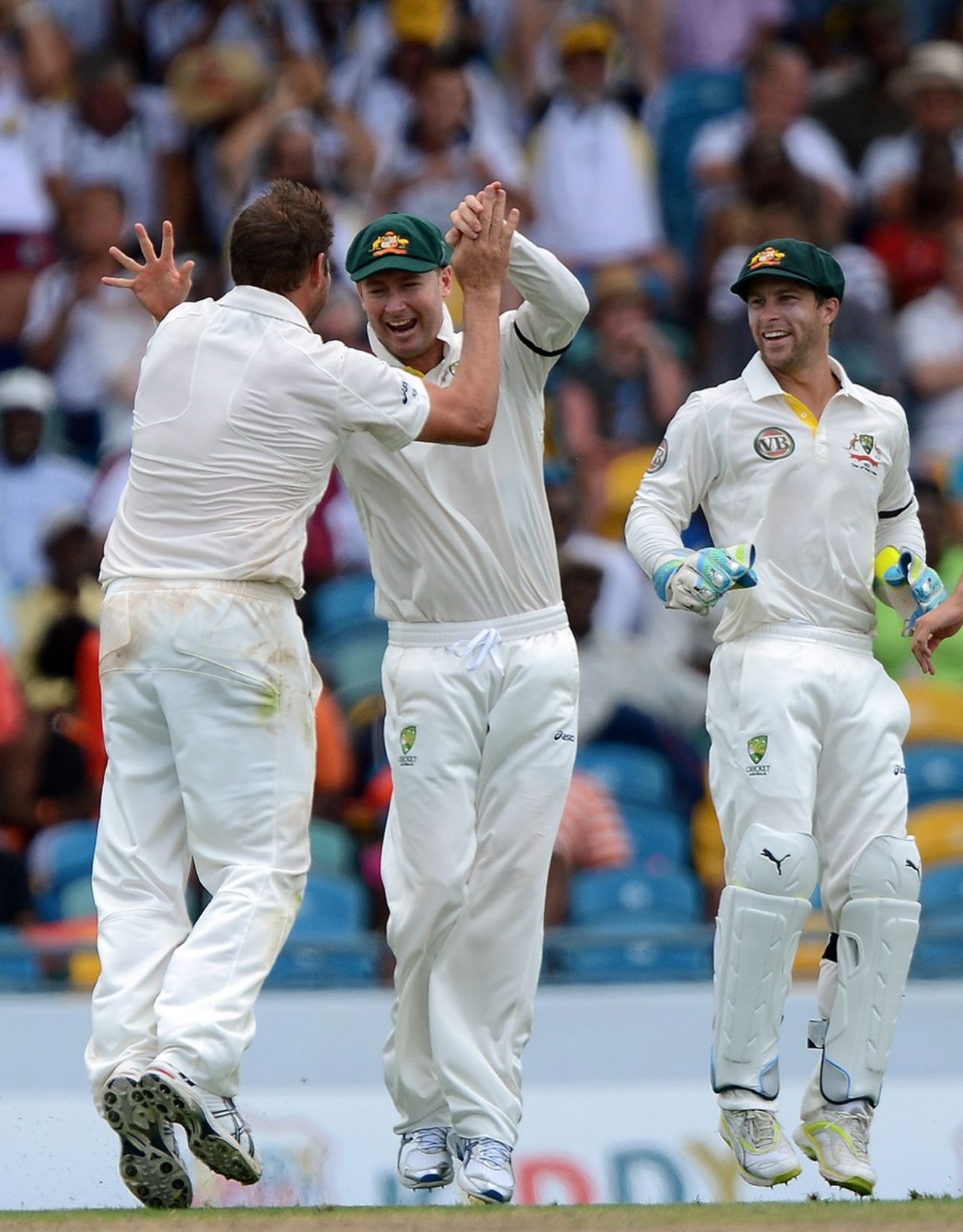 Michael Clarke and Ryan Harris celebrate a wicket, West Indies v Australia, 1st Test, Barbados, 1st day, April, 7, 2012