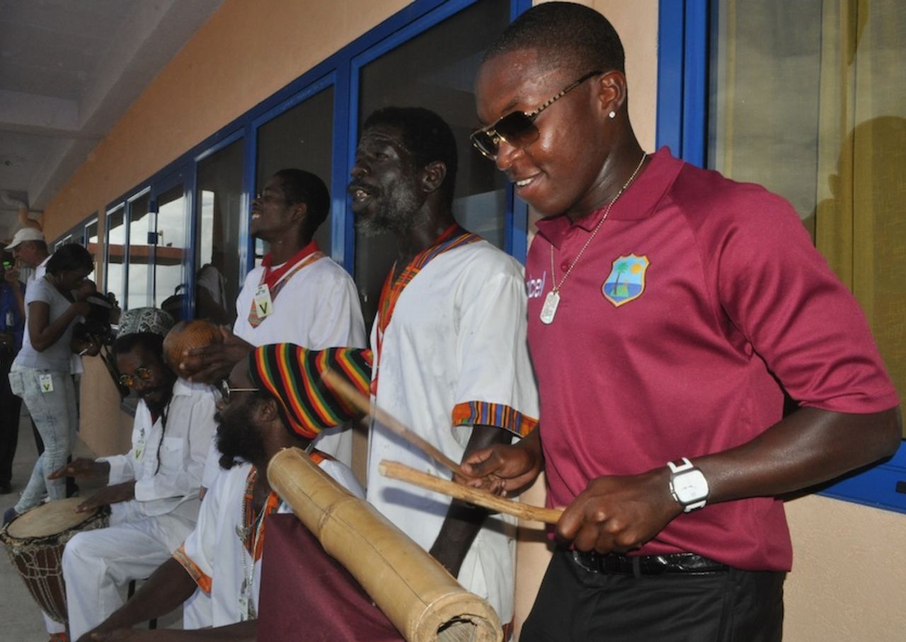 Fidel Edwards plays with the band on arrival in Dominica, Dominica, April 22, 2012