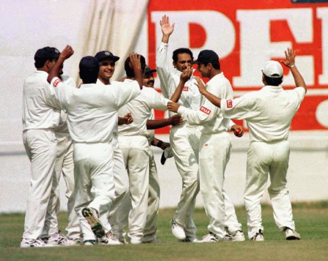 The Indian team celebrates the dismissal of Michael Slater caught by Mohammad Azharuddin off the bowling of David Johnson on day three of the 1996-97 India vs Australia Test at New Delhi