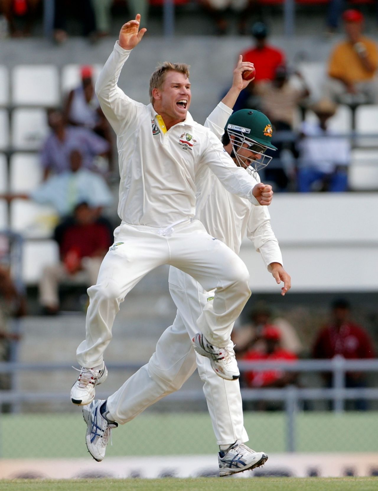 David Warner jumps for joy after taking a wicket, West Indies v Australia, 3rd Test, Roseau, 2nd day, April 24, 2012