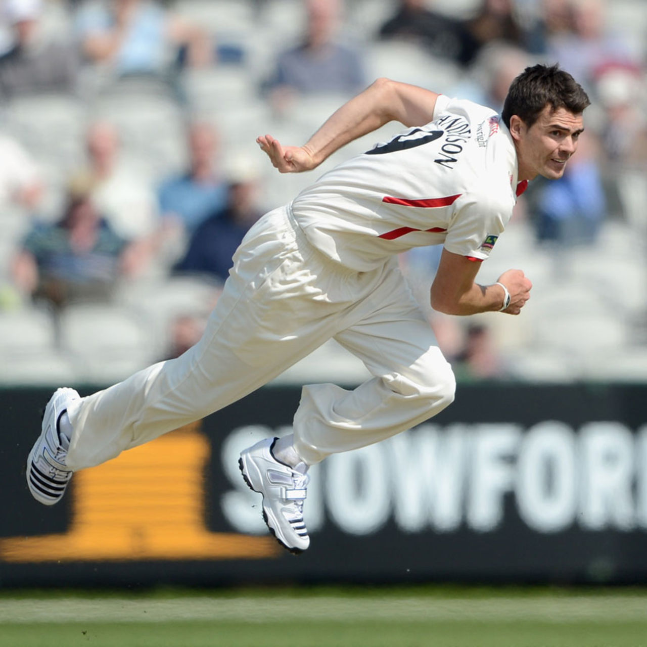 James Anderson follows through after delivering the ball, Lancashire v Nottinghamshire, County Championship, Division One, Old Trafford, 1st day, May 2, 2012