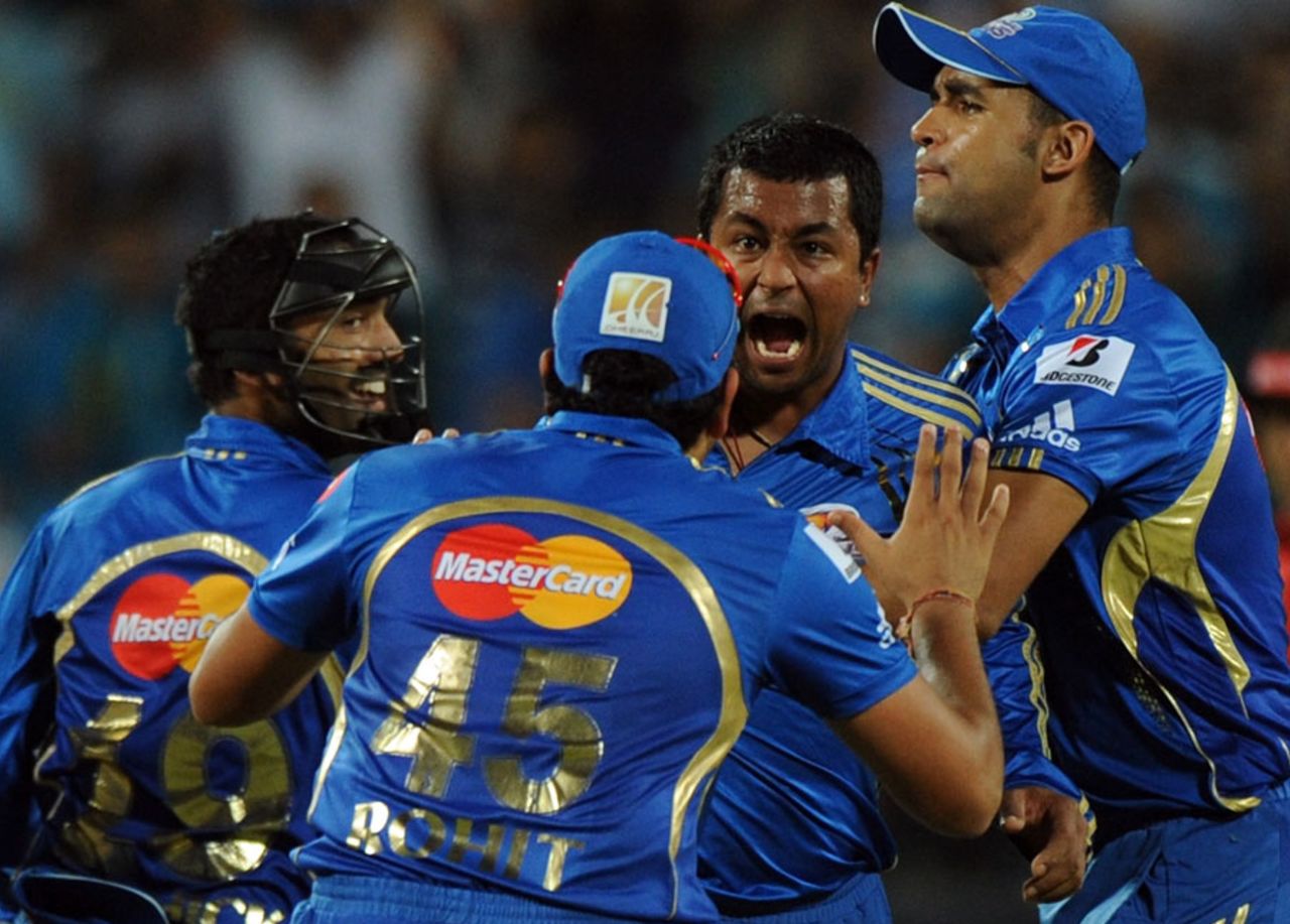 Team-mates congratulate Pragyan Ojha for a wicket, Pune Warriors v Mumbai Indians, IPL, Pune, May 3, 2012