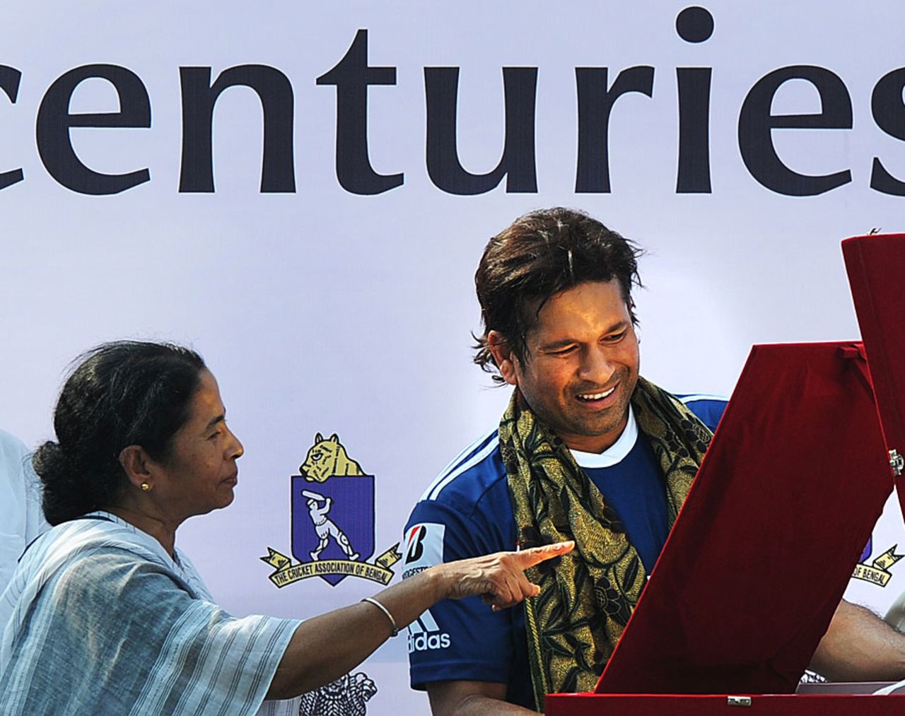 West Bengal chief minister Mamata Banerjee presents an award to Sachin Tendulkar for scoring 100 international centuries, Kolkata, May 12, 2012