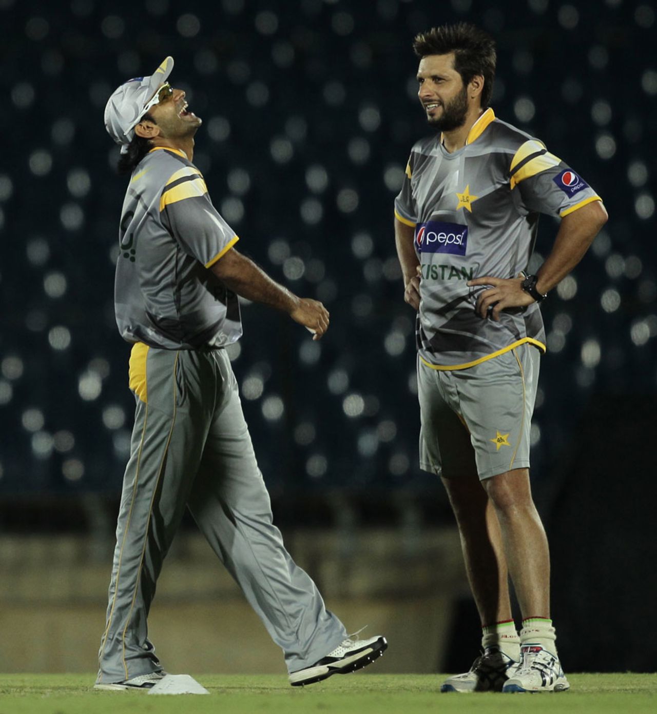 Mohammad Hafeez shares a laugh with Shahid Afridi during Pakistan's training session, Hambantota, May 31, 2012