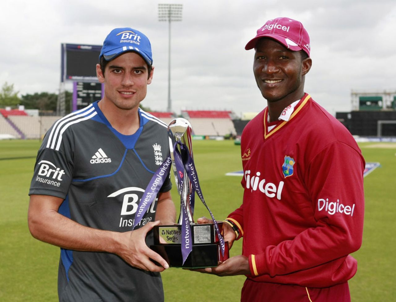 Captains Alastair Cook and Darren Sammy pose with the trophy ahead of the one-day series between England and West Indies, West End, June 15, 2012