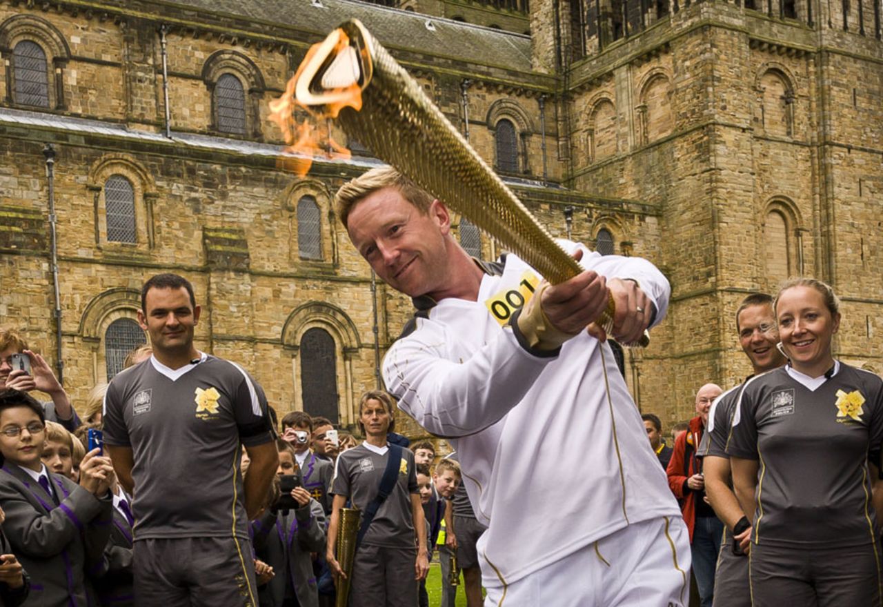 Durham's Paul Collingwood with the Olympic torch, Durham, June 17, 2012