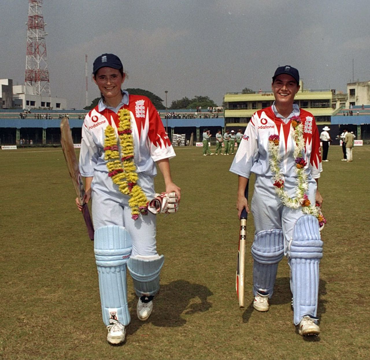 Charlotte Edwards and Jane Smit walk back after unbeaten 131-run stand, England v Ireland, women's World Cup, Poona, December 16, 1997 