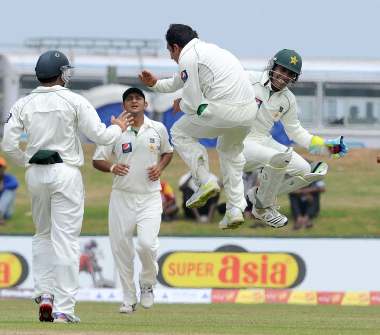 Saeed Ajmal and Adnan Akmal jump for joy after dismissing Tharanga Paranavitana, Sri Lanka v Pakistan, 1st Test, Galle, 1st day, June 22, 2012 