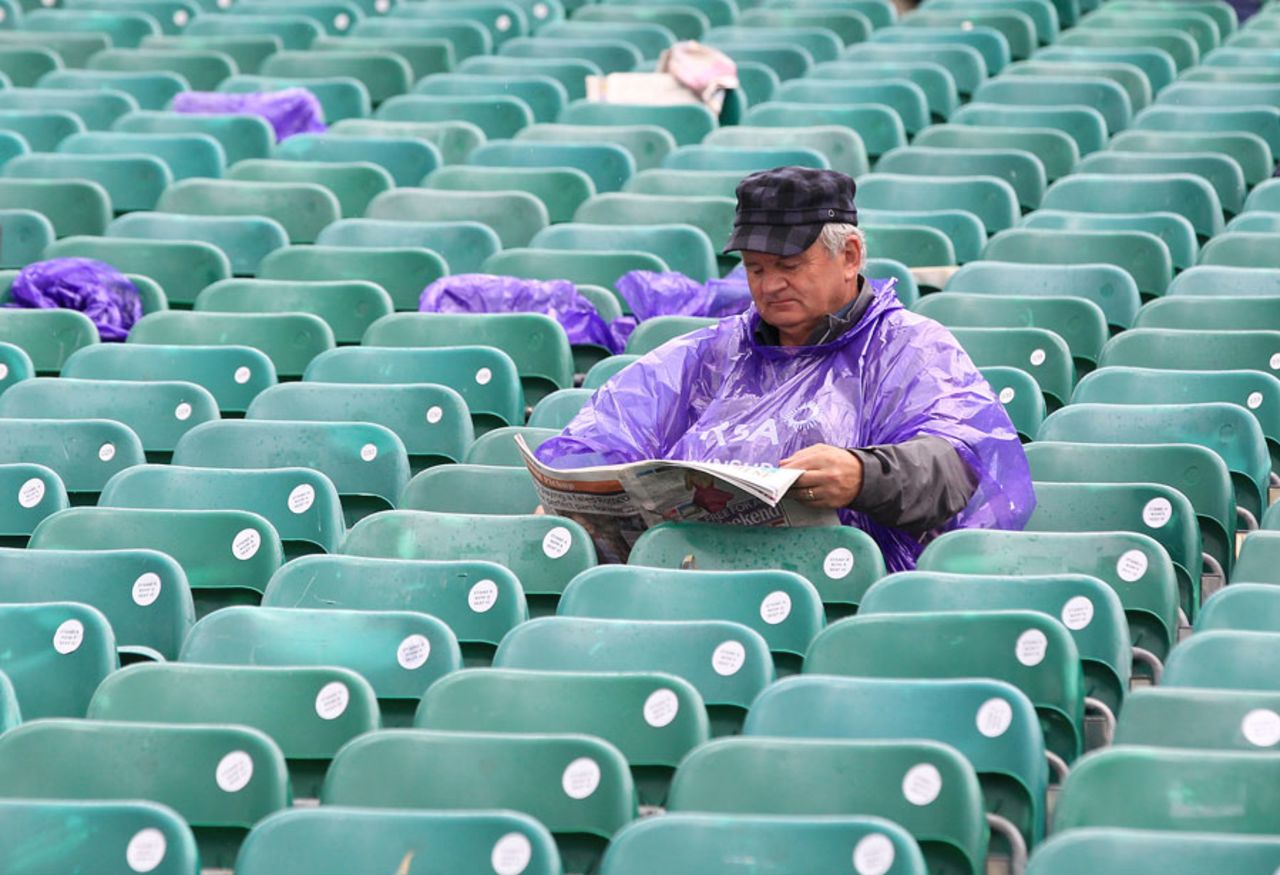 A spectator braves the conditions in Belfast, Ireland v Australia, ODI, Stormont, June 23, 2012