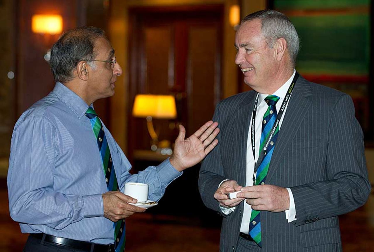 The ICC chief executive Haroon Lorgat has a word with Alan Isaac, the current ICC vice-president, Kuala Lumpur, June 24, 2012