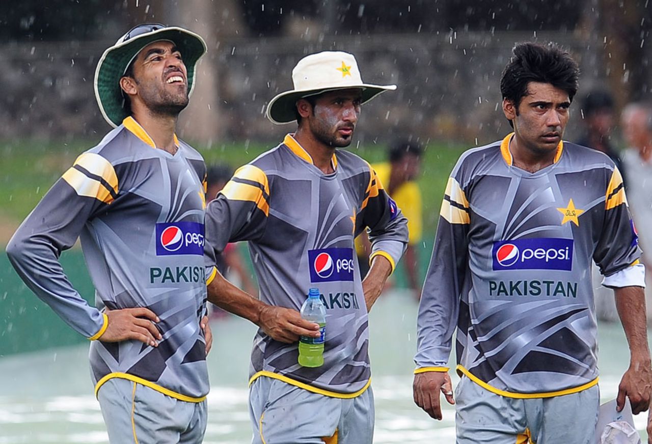 Pakistan's quicks in the drizzle at a training session, Colombo, June 28, 2012