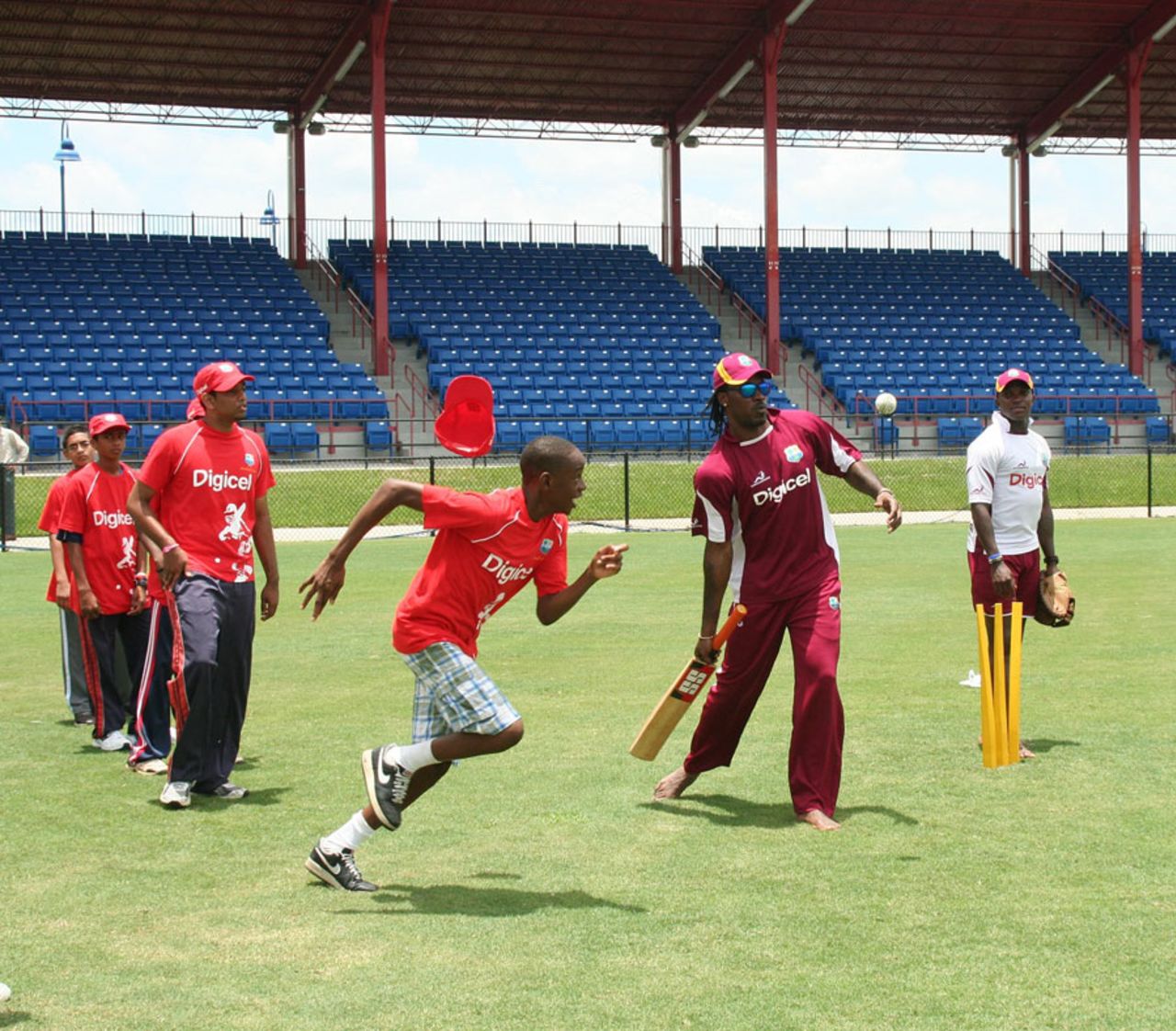 Chris Gayle and Fidel Edwards work with some local youth, Lauderhill, Florida, June 28, 2012