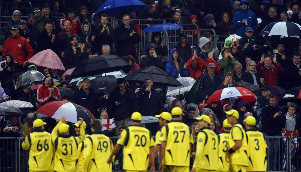 Australia's players leave the field for a rain delay, England v Australia, 5th ODI, Old Trafford, July 10, 2012